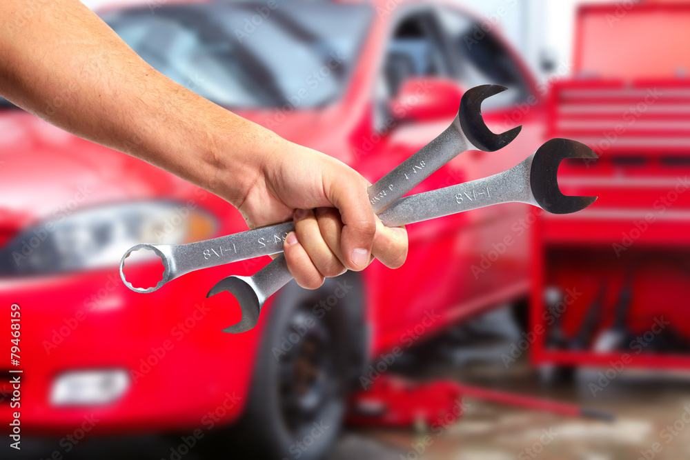 Hand of car mechanic with wrench. Hand of car mechanic with wrench.
