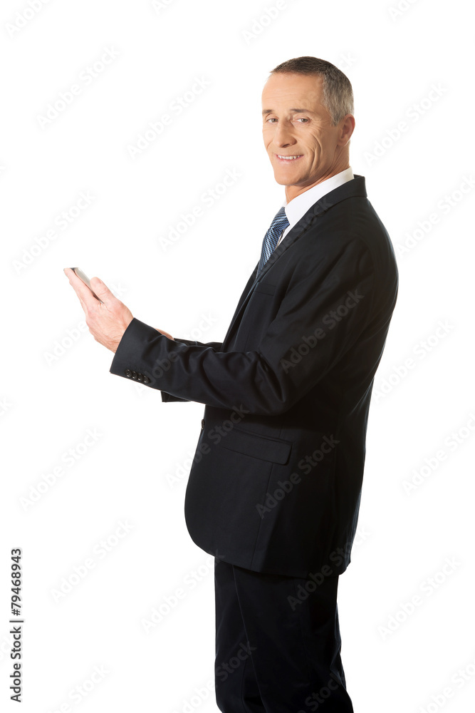 Mature man using digital tablet Mature man using digital tablet