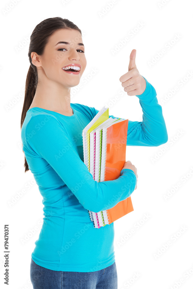 Portrait of woman holding notes showing thumbs up Portrait of woman holding notes showing thumbs up
