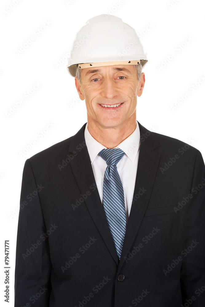 Smiling businessman with hard hat Smiling businessman with hard hat