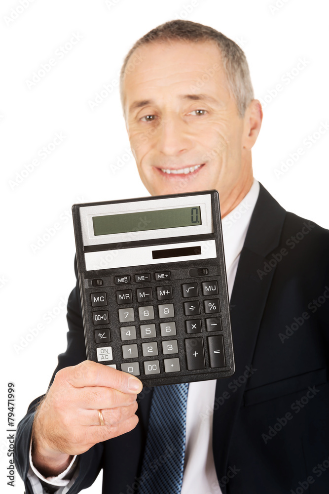 Happy businessman holding a calculator Happy businessman holding a calculator