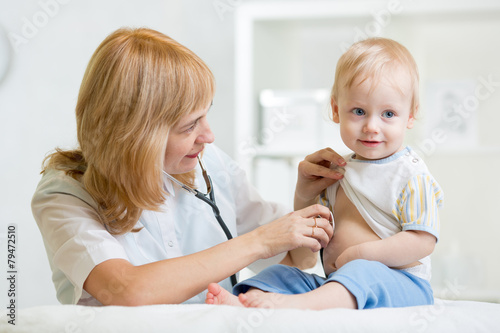 doctor woman examining hear...