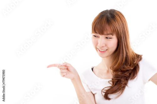 smiling, happy woman pointing sideway