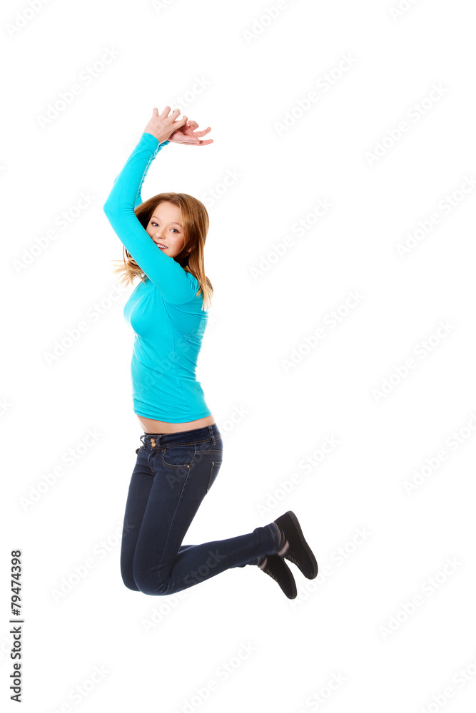 Young woman jumping with joy