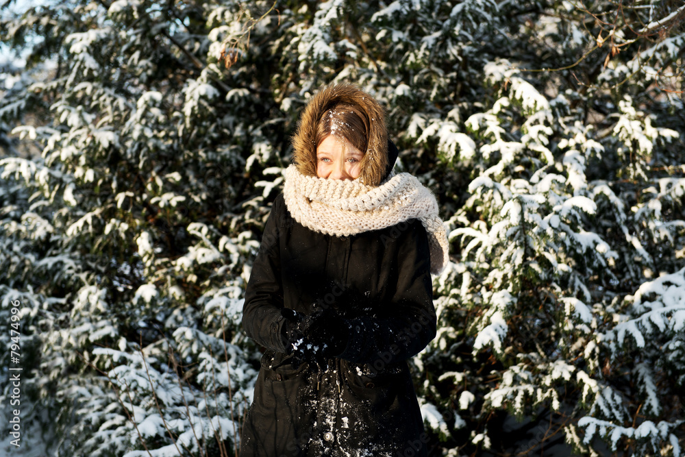 Young woman making snowball Young woman making snowball