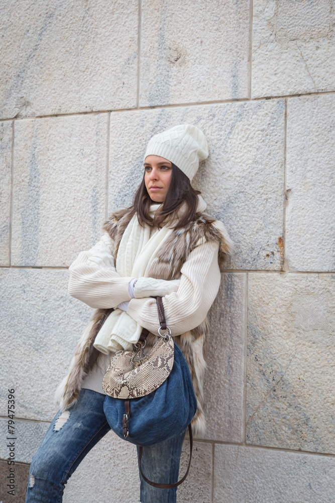 Beautiful young woman posing in the city streets Beautiful young woman posing in the city streets