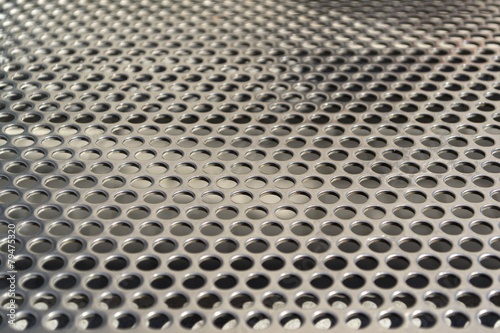 Metal plate with round holes texture