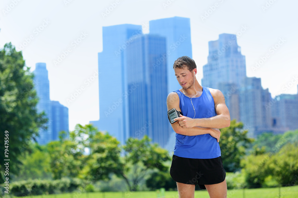 New York City runner listening music on smartphone