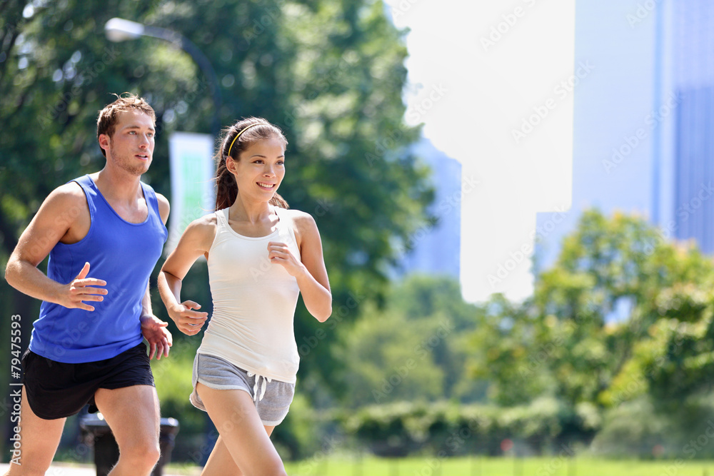 Runners jogging in New York City Central Park, USA - obrazy, fototapety, plakaty 