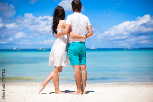 Young couple on tropical beach during summer vacation