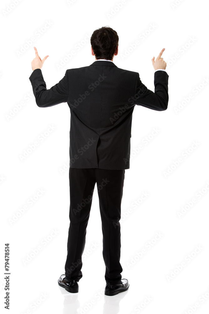 Happy businessman points his finger up. Happy businessman points his finger up.