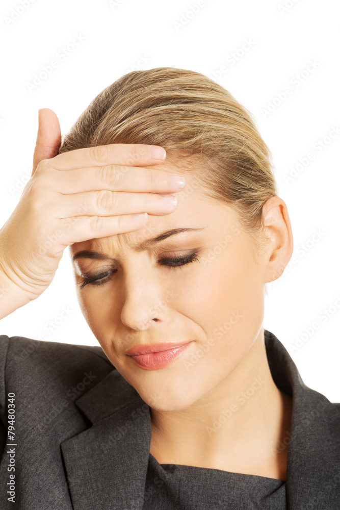 Businesswoman having huge headache Businesswoman having huge headache