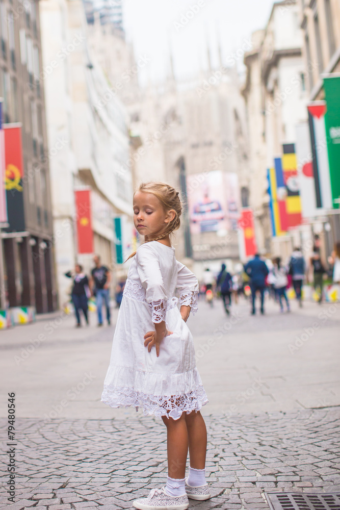Little adorable girl walking in Milan on italian vacation