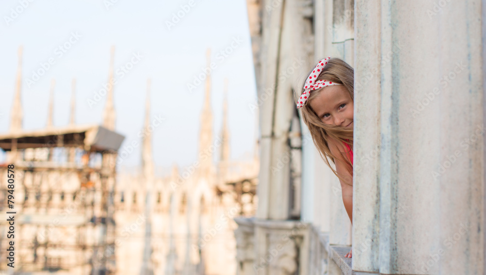 Adorable little girl on the rooftop of Duomo, Milan, Italy