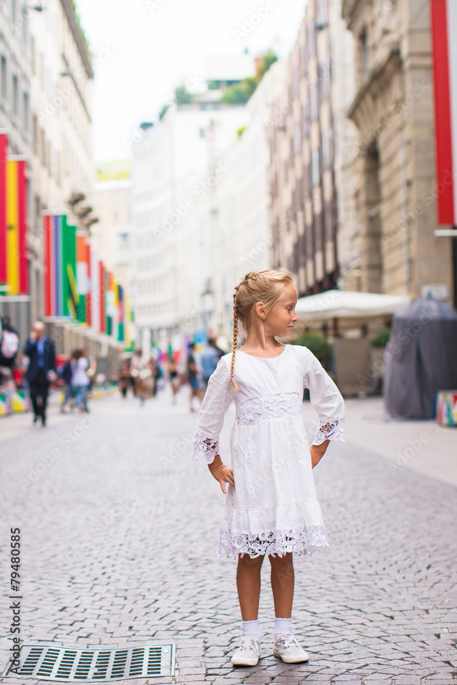 Little adorable girl walking in Milan on italian vacation