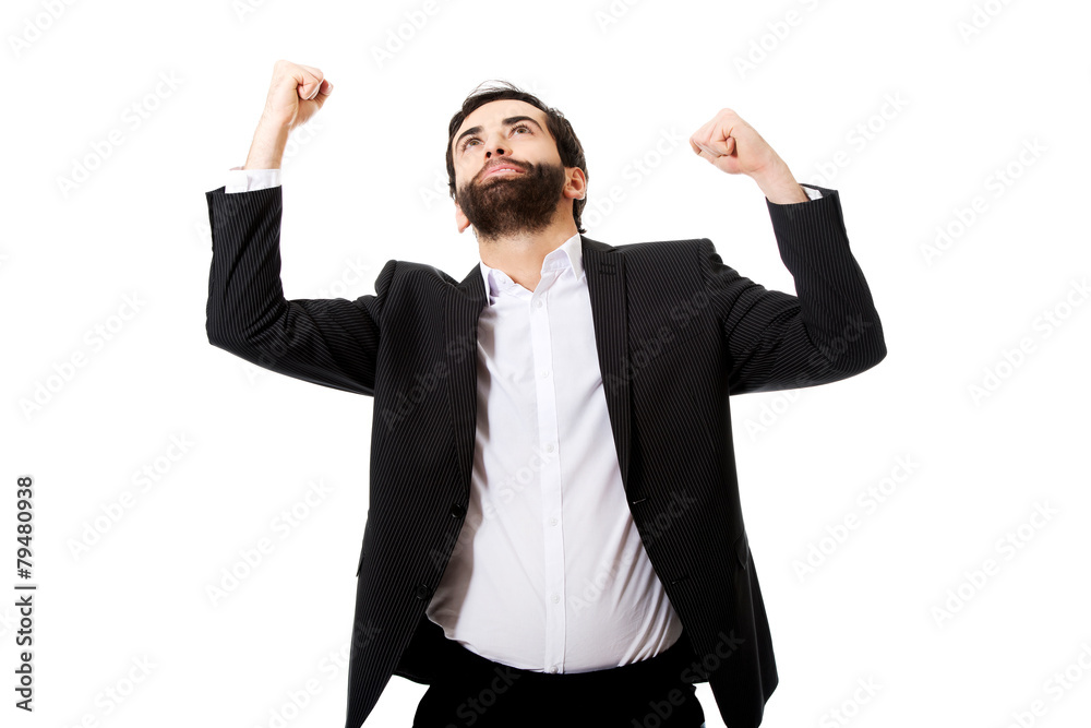 Successful excited businessman making fists. Successful excited businessman making fists.