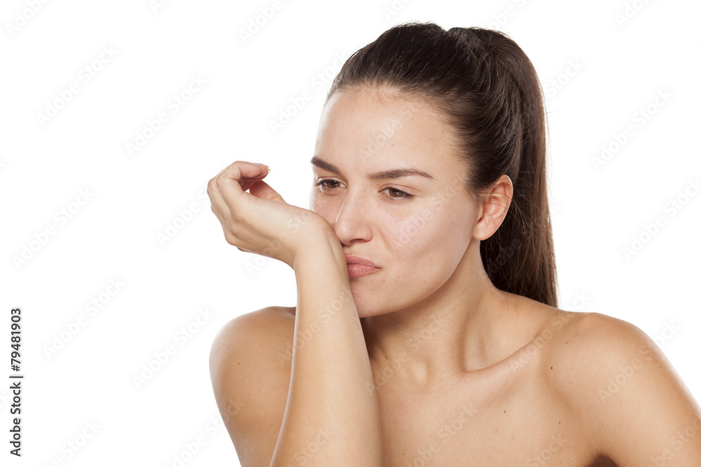 young woman enjoying the scent of her perfume young woman enjoying the scent of her perfume