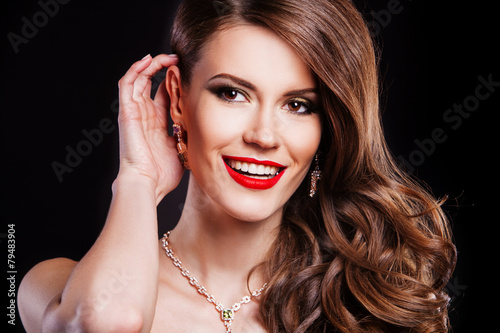 portrait of a beautiful brunette girl with luxury accessories