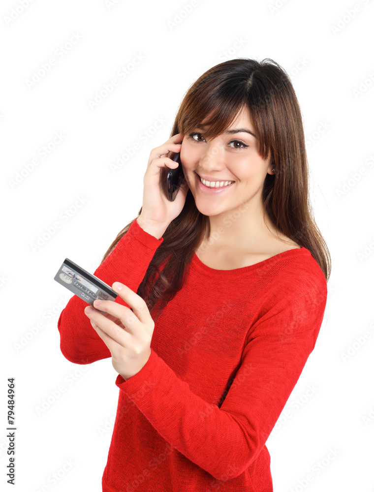 Girl looking with credit card on mobile phone Girl looking with credit card on mobile phone
