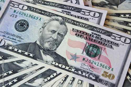 Dollar notes in denominations of $ 50, lying face.