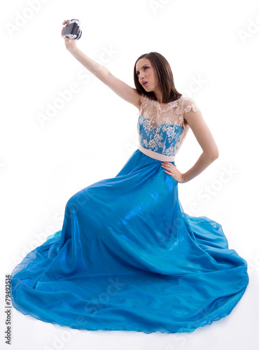 Beautiful woman in a blue dress shooting