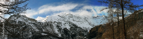 panorama view of snowy alpine mountains in italy