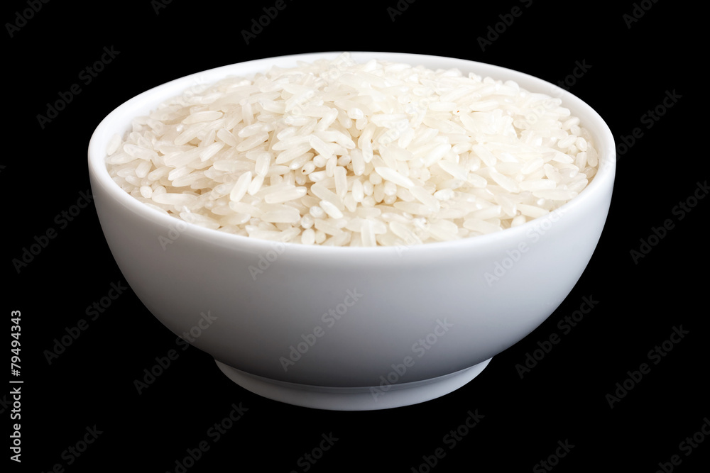 Bowl of uncooked white long grain rice on black. Clipping path. Bowl of uncooked white long grain rice on black. Clipping path.