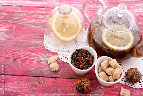 drink in glass teapot on wooden background