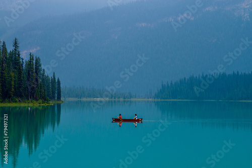 canoeing tranquil emerald lake