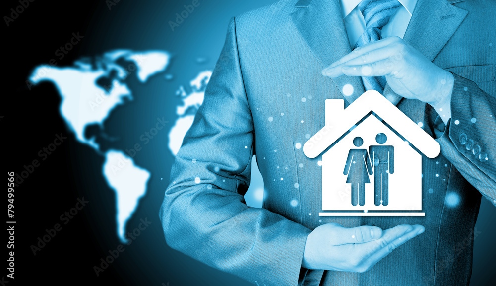 businessman protecting family in home with hands businessman protecting family in home with hands