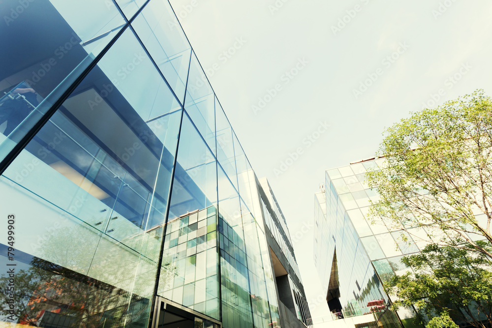 modern office building exterior and glass wall - obrazy, fototapety, plakaty 