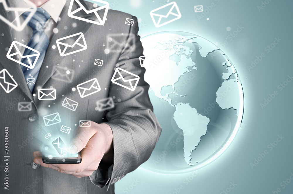 Business man holding smart phone and sending emails Business man holding smart phone and sending emails