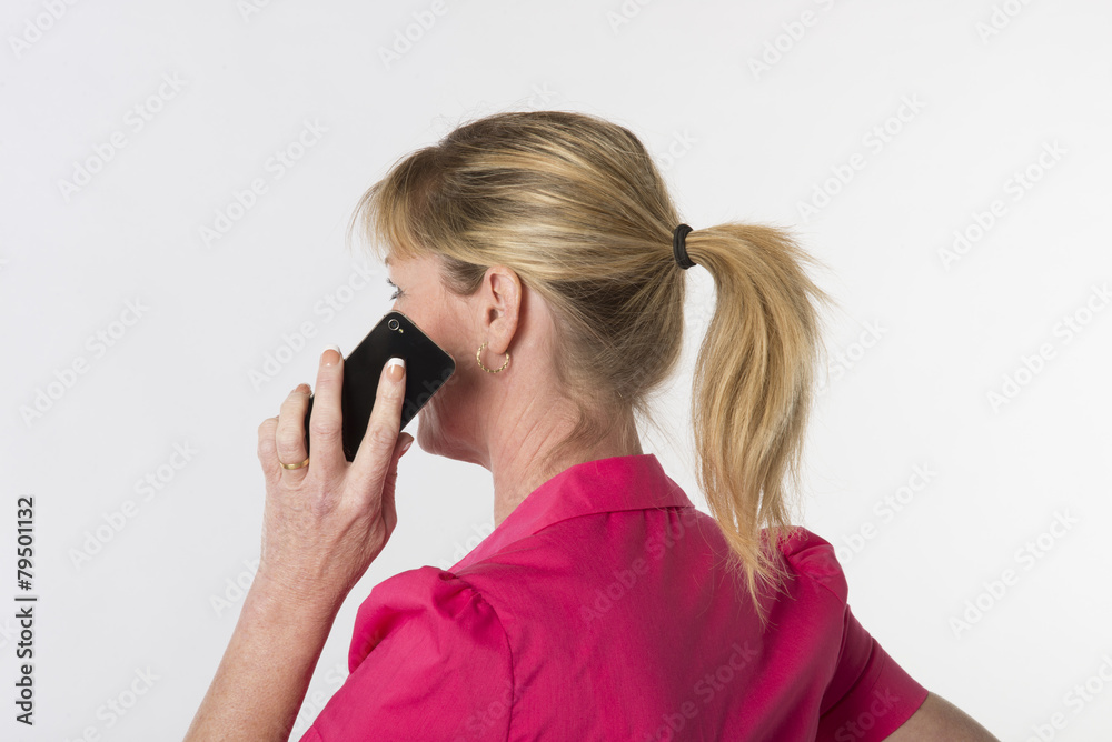Blond woman using a mobile phone Blond woman using a mobile phone