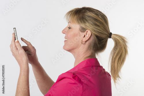 Blond woman using a mobile phone