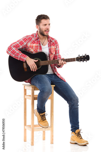 Obraz na plátně The guitarist on a chair