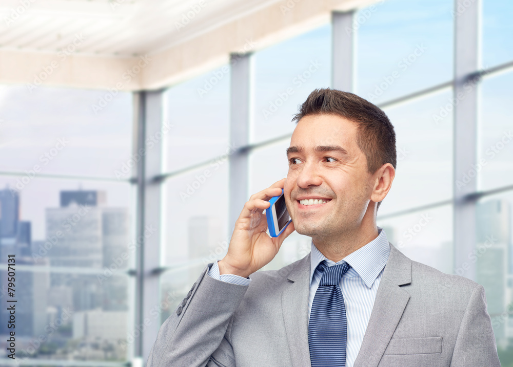happy businessman calling on smartphone