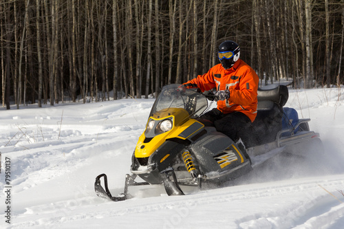 Athletes on a snowmobile.