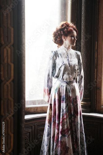 Photography woman in pink dress posing in luxury palace
