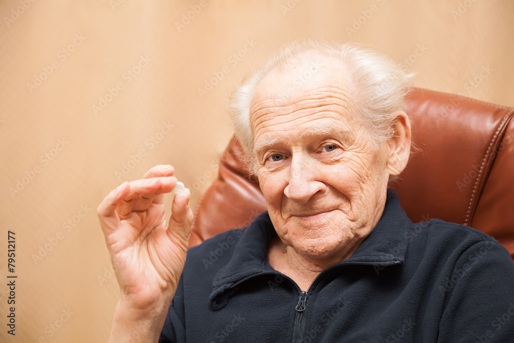 senior man holding a tablet senior man holding a tablet