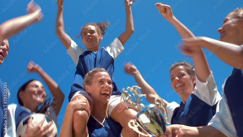 Pretty football players celebrating their win Pretty football players celebrating their win