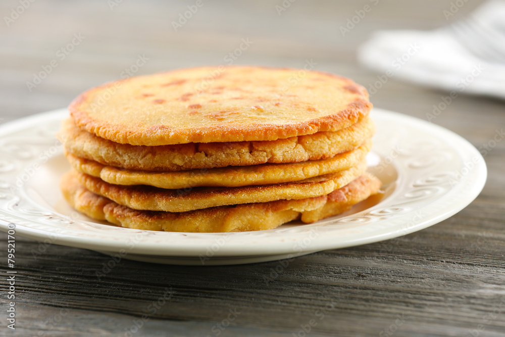 Tasty fritters on plate on table close up Tasty fritters on plate on table close up
