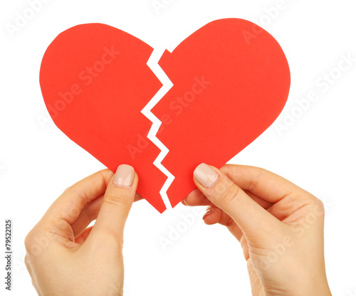 Female hands holding broken heart isolated on white