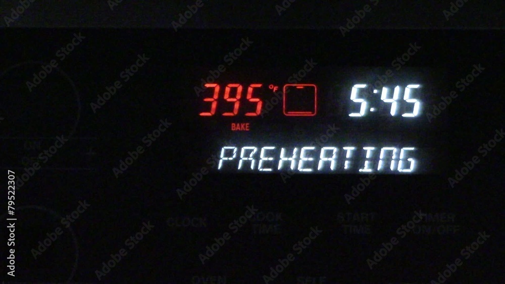 An oven preheating & showing clock display