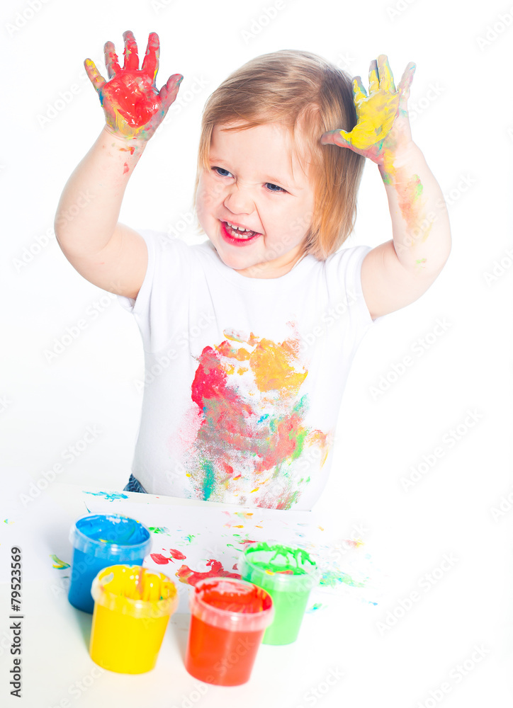 Little girl playing with finger paints Little girl playing with finger paints