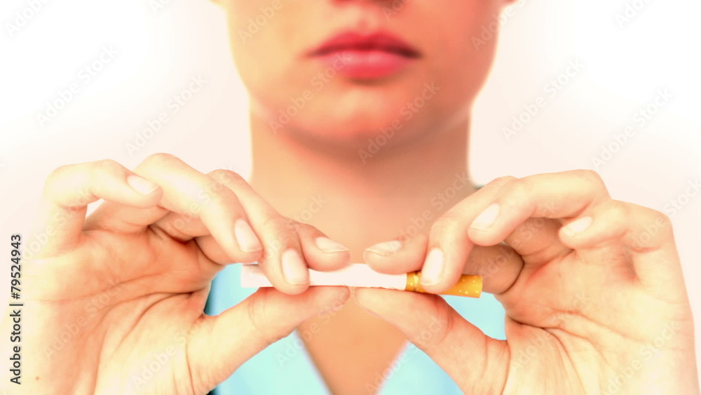 In slow motion serious woman breaking a cigarette In slow motion serious woman breaking a cigarette