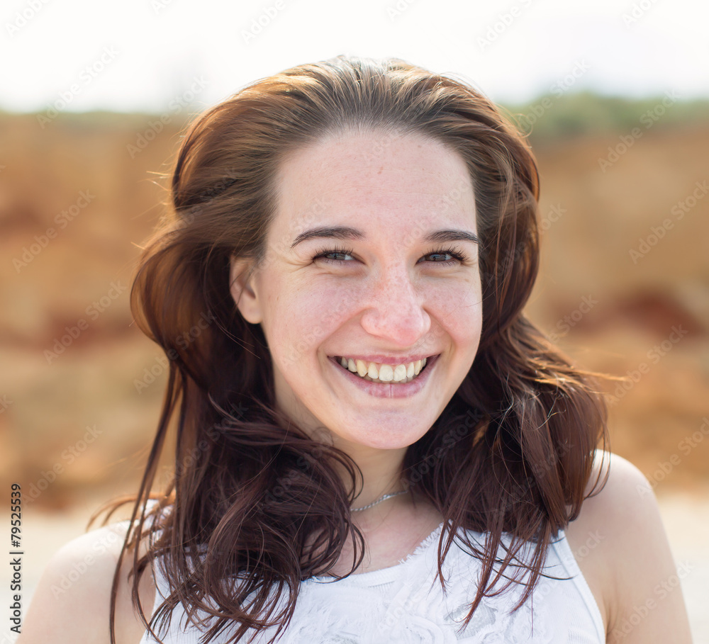 Brunette looking at camera smiling Brunette looking at camera smiling