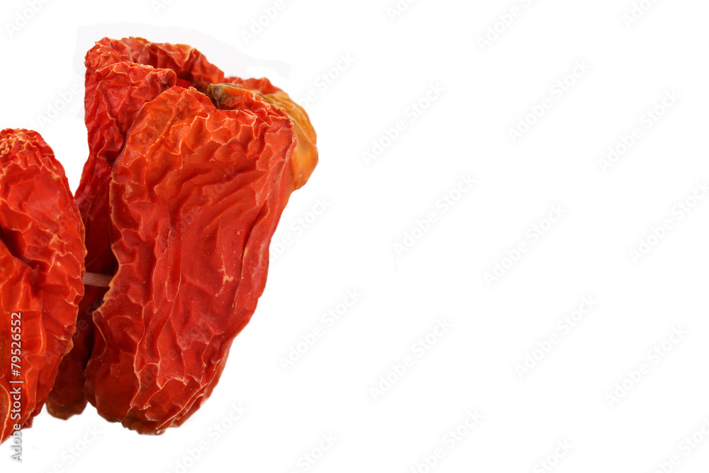 Dried red peppers on the white background