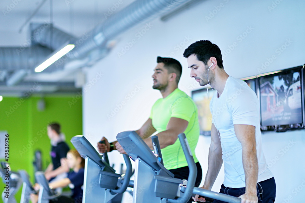 Group of people running on treadmills Group of people running on treadmills