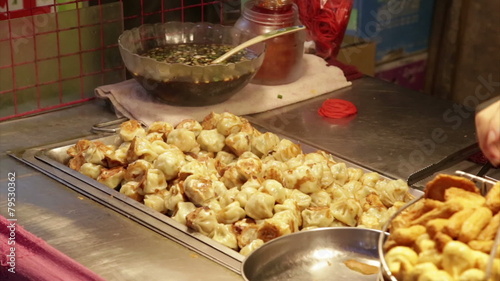 Dumplings grilling at vendor in Lehua Night Market in the Yonghe photo