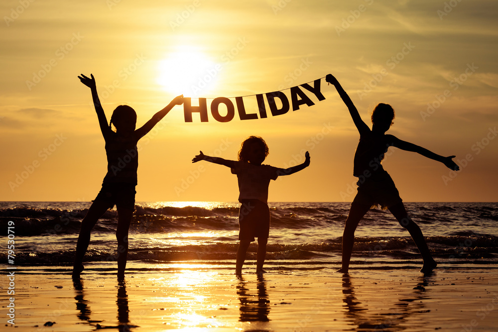 Fototapeta premium Happy children playing on the beach
